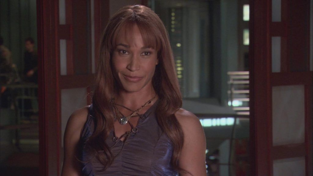 Teyla Emmagan (Rachel Luttrell) smiles mischieviously.