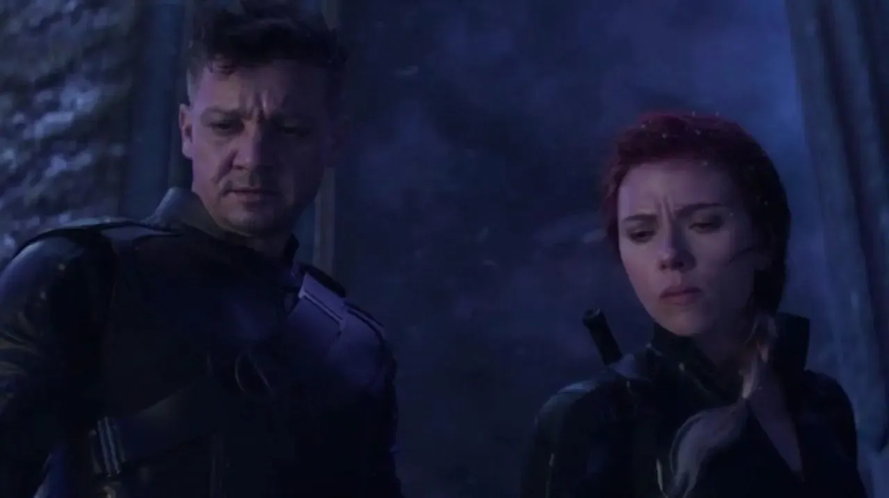 Natasha Romanoff (Scarlet Johansson) and Clint Barton (Jeremy Renner) look down over the cliff edge..