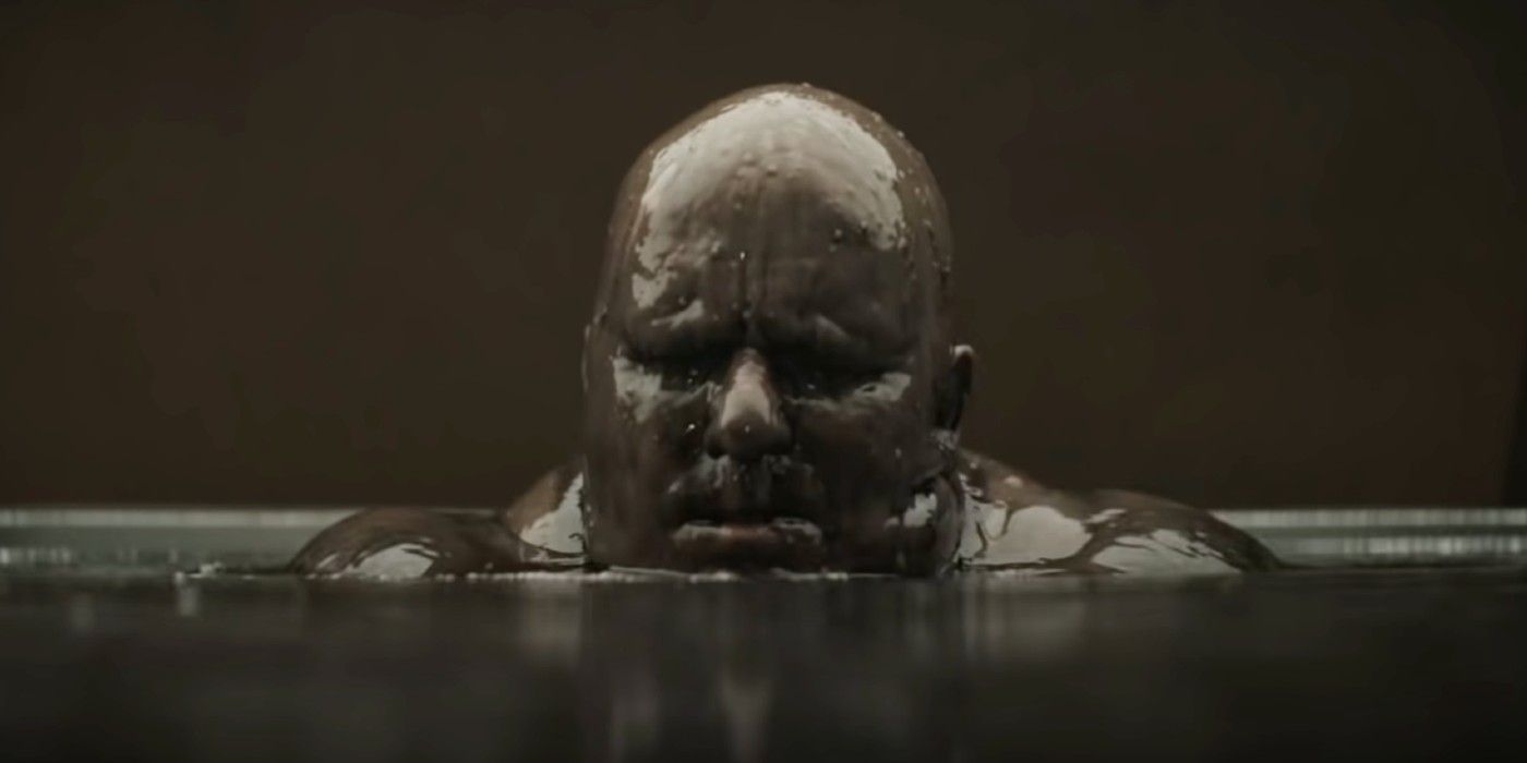  Baron Vladimir Harkonnen (Stellan Skarsgård) is partially submerged in oil.