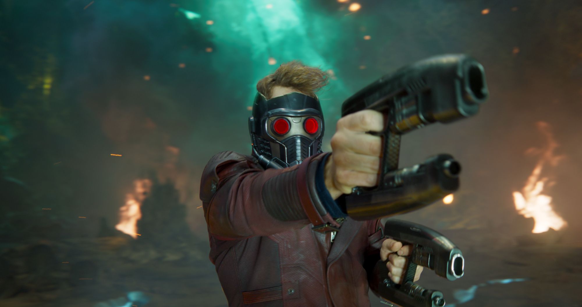 Peter Quill/Star-Lord (Chris Pratt), his helmet down, points his blasters as his father.