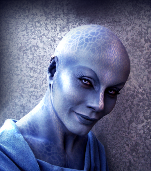 Pa'u Zotoh Zhaan (Virginia Hey) is a bald, blue alien with a chlorophyll pattern pattern on her skin.