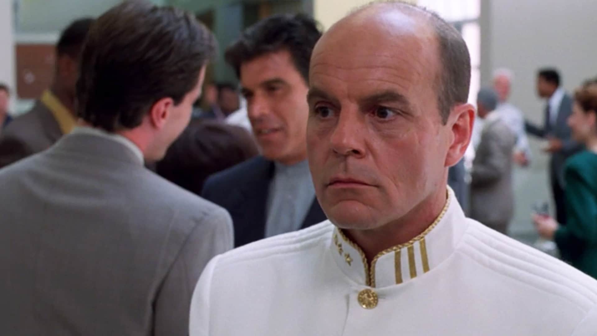Captain Oliver Hudson (Michael Ironside) in his white dress uniform.
