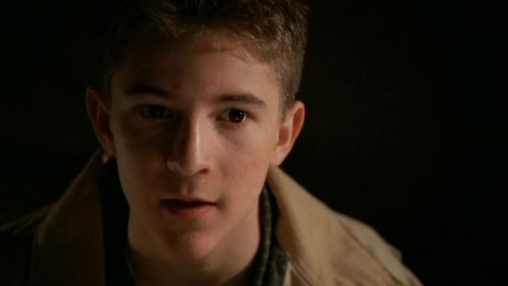 Teenage Jack O’Neill (Michael Welch) in a tan jacket.