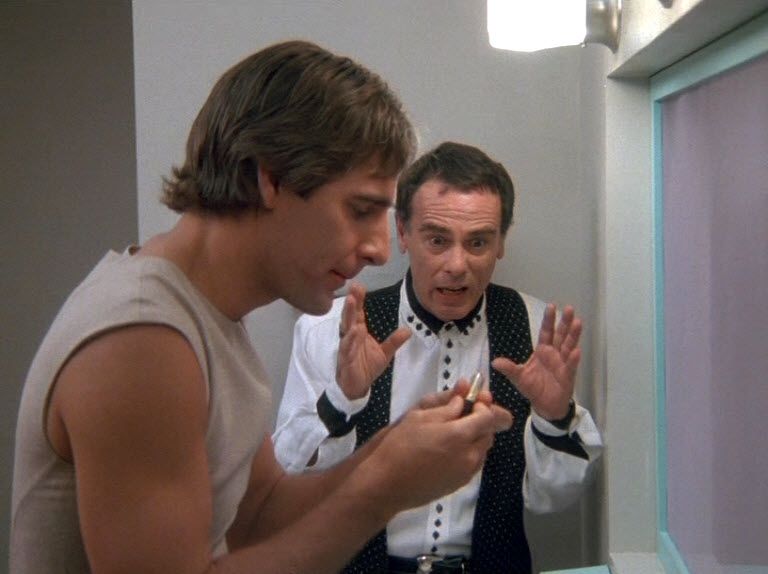 Al Calavicci (Dean Stockwell) gesticulates widly.