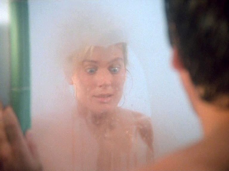 Sam Beckett (Scott Bakula) sees Samantha Stormer (LaReine Chabut) in the steamy bathroom mirror.