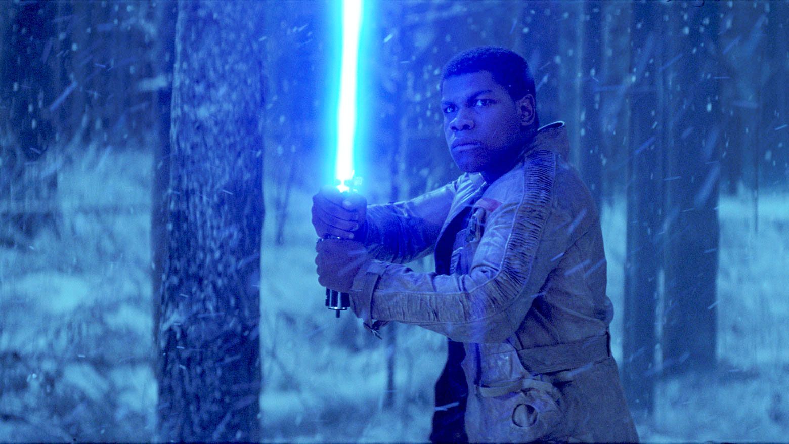 Finn (John Boyega) wields Rey’s lightsaber.