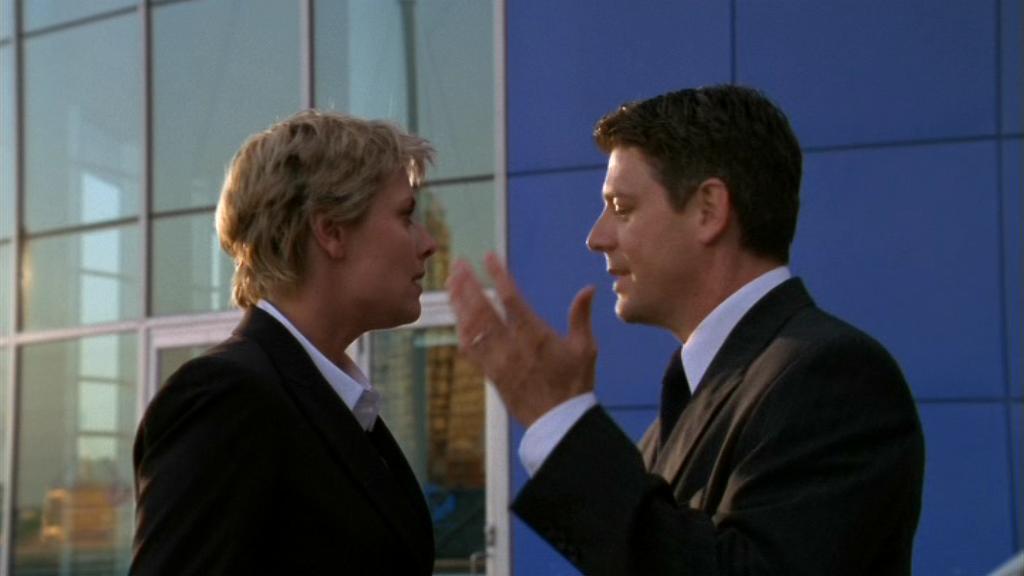 Samantha Carter (Amanda Tapping) pleads with her husband Joe Faxon (Christopher Cousins).