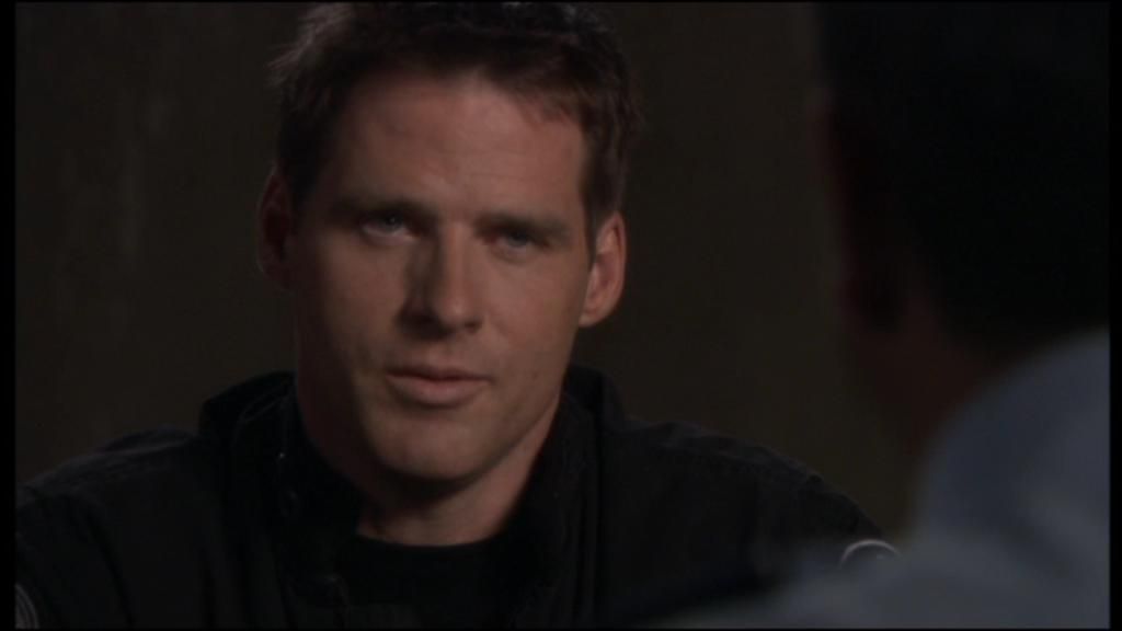 The black-clad Cameron Mitchell (Ben Browder)
