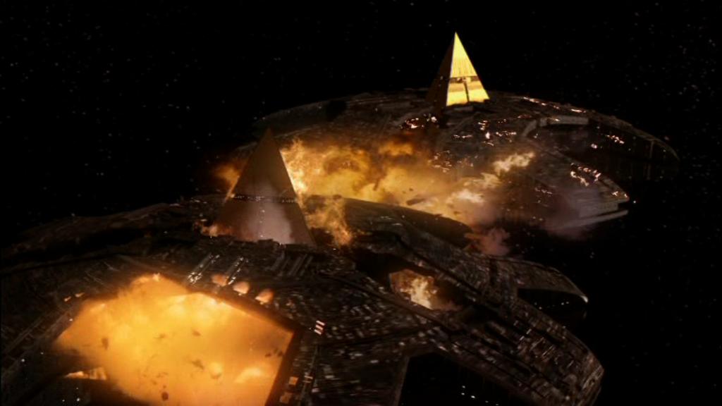 Two Ha’tak pyramid ships explode as they collide.