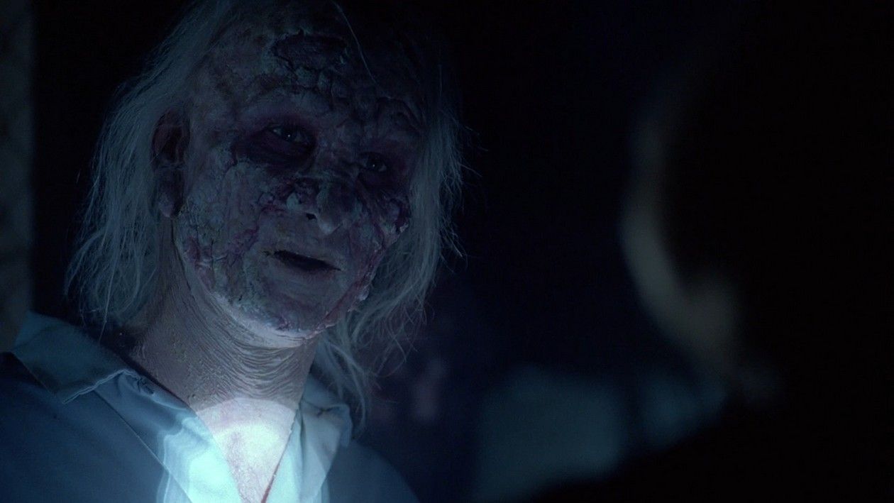 The leper Escalante (Colin Cunningham) in The X-Files episode ‘731’. He has long grey hair and his face is heavily disfigured, although partly obscured by shadow.