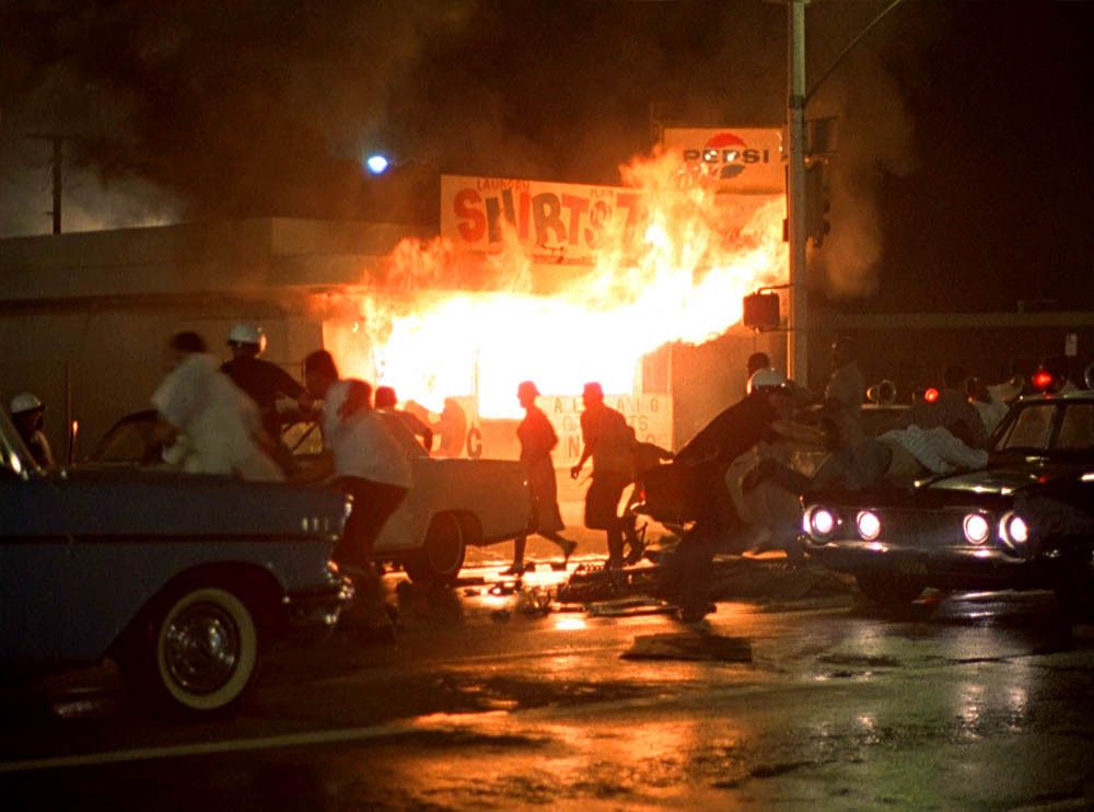 A building burns during the Watts Riots.
